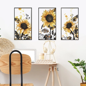 Detail of sunflower triptych wall art with gold leaf accents and black frame