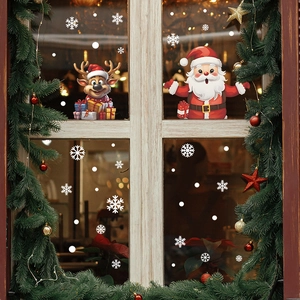 Christmas window stickers featuring cartoon Santa Claus, reindeer, and white snowflakes