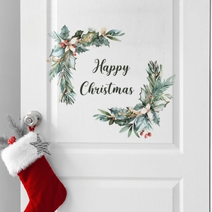 Happy Christmas wall decal with watercolor holly wreaths on a white wooden door