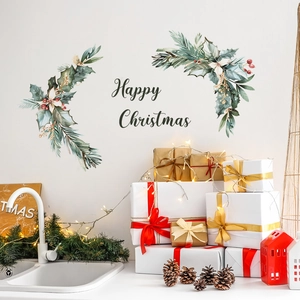 Watercolor Happy Christmas wall sticker with holly leaves and pine needles on white wall