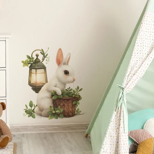 Cartoon white rabbit wall sticker with lantern and green potted plants in nursery room