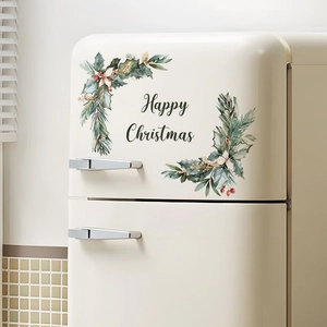 Detail of Happy Christmas wall decal with green leaves on a retro beige refrigerator