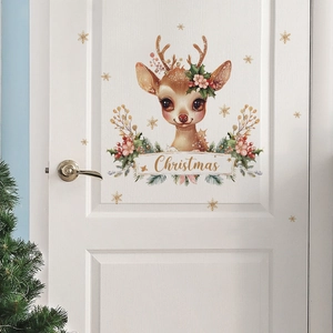 Close-up of a Christmas reindeer wall sticker with flowers on a white wooden door