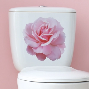 Pink rose flower wall sticker for bathroom decor applied on a white ceramic toilet tank