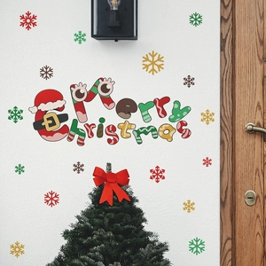 Festive Merry Christmas wall decals with colorful snowflakes on a white cozy home interior wall