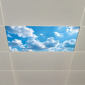 Close-up of a rectangular LED ceiling panel light with a blue sky and white cloud design
