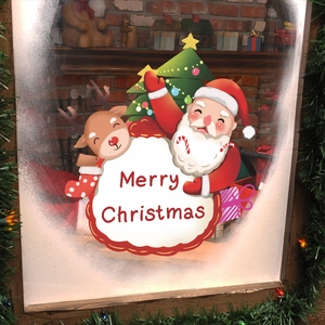 Christmas window decals featuring Santa, reindeer, and Merry Christmas text on snowy glass