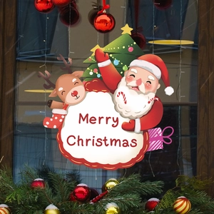 Christmas window decals with Santa, reindeer, and Merry Christmas text on glass