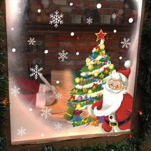 Christmas window stickers set with Santa Claus, decorated tree and white snowflakes decals