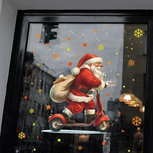 Christmas window decal featuring Santa Claus on a scooter with colorful snowflakes