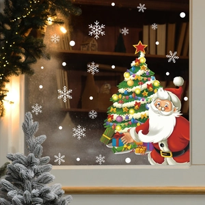 Detail view of Santa Claus and Christmas tree window stickers with snowflake decorations