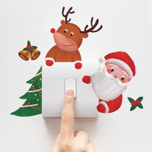 Close-up of Christmas gnome and reindeer decals applied to a standard light switch