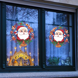 Cartoon Santa wreath window stickers with golden bells and festive holiday ornaments