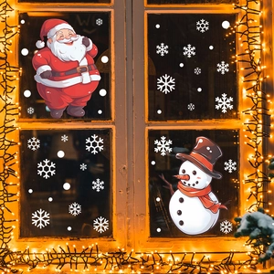 Christmas window stickers featuring Santa Claus, a snowman, and white snowflakes on glass