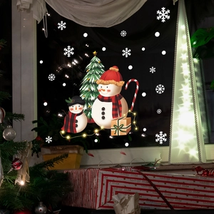 Festive Christmas window decals featuring snowmen and tree for warm holiday atmosphere