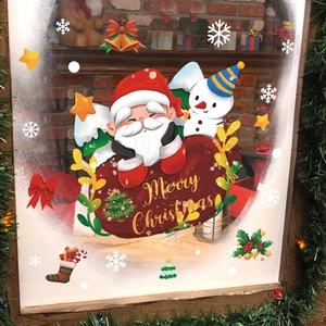 Festive Christmas window decals featuring Santa, snowman, and Merry Christmas text decor