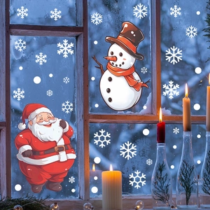 Close-up of Santa Claus and snowman window decals applied to a glass window pane