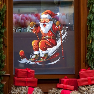 Vibrant Christmas skiing Santa Claus window sticker on glass with festive holiday decor