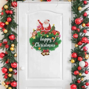 Close-up of Happy Christmas Santa Claus and reindeer wall decals on a white door