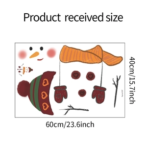 Flat lay of Christmas snowman wall decal showing product dimensions 60cm by 40cm