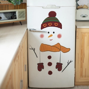 DIY Christmas snowman wall decal with red heart hat and scarf on a vintage white fridge