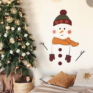 Christmas snowman wall sticker with red hat and scarf on a cozy room wall near a festive tree