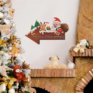 Sticker mural de Noël avec Père Noël et renne au-dessus d'une cheminée décorée