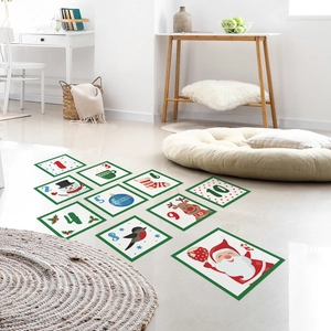 Macro detail of Christmas hopscotch floor stickers with Santa and snowman patterns