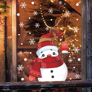 Christmas window stickers featuring a waving snowman with red hat and white snowflakes