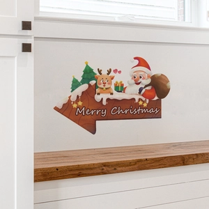 Détail de stickers muraux Joyeux Noël avec Père Noël et rennes sur un mur blanc propre