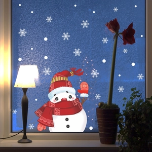 Detail of Christmas waving snowman window sticker with white snowflakes decoration