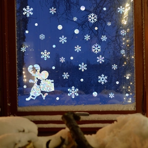 Detailed view of 3D iridescent Christmas reindeer and snowflake window film sticker