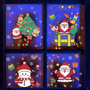 Détails de stickers de Noël Père Noël et bonhomme de neige sur fond de verre sombre