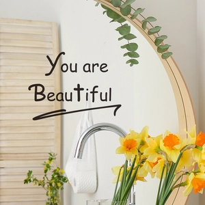 Semi-circular wall mirror with natural wood frame featuring You are Beautiful text