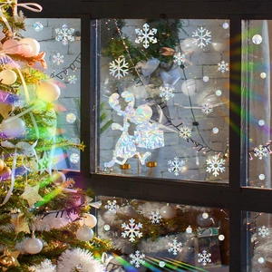 Rainbow prism Christmas window decals with reindeer and snowflake patterns on glass