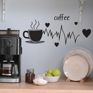 Detail of coffee cup wall decal with heartbeat line and heart icon on a kitchen wall