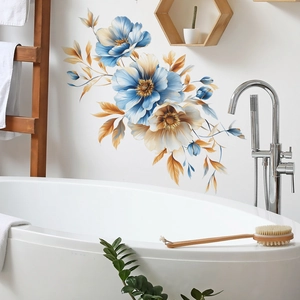 Detailed close-up of blue and gold floral wall decals in a modern white bathroom setting