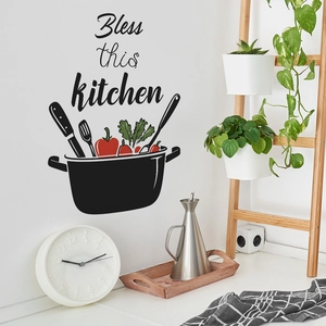 Black minimalist kitchen wall sticker featuring 'Bless this kitchen' pot and greens silhouette