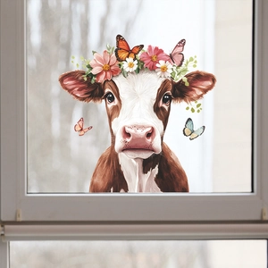 Detail of creative window sticker with hand-painted cow, floral crown and butterflies
