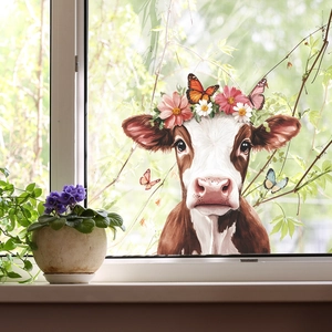 Creative window cling with a cute cow head wearing floral crown and butterfly accents