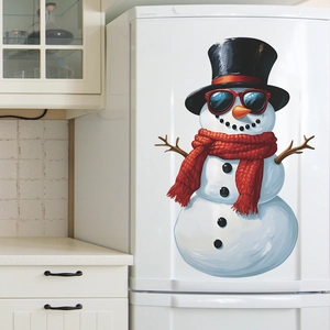 Detailed view of snowman fridge sticker with red sunglasses and knit scarf on white door