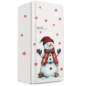 Détails de stickers de Noël bonhomme de neige et flocons rouges sur un frigo blanc