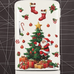 Detail showing Santa Claus and Christmas tree wall stickers on a white fridge surface