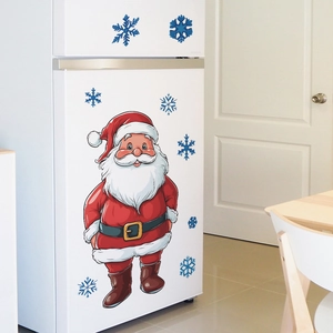Detailed view of Santa Claus and blue snowflake fridge stickers on a white surface