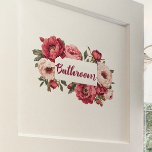 Elegant floral bathroom wall decal featuring red roses and vintage script on a white door