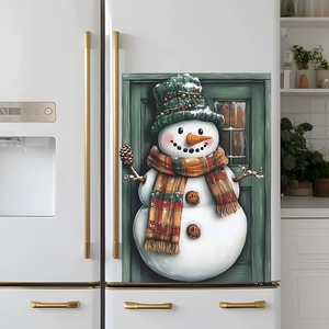 Christmas snowman fridge magnets decoration on a white refrigerator for festive home atmosphere