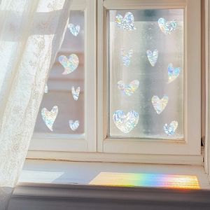 Iridescent heart window stickers with prismatic glass texture for rainbow suncatcher effect