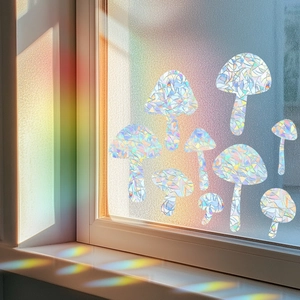 Detailed view of nine mushroom window decals creating colorful rainbow light effects