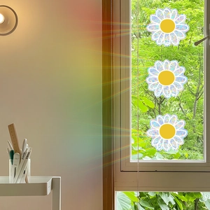 Rainbow prism daisy glass window stickers showing colorful holographic floral reflections