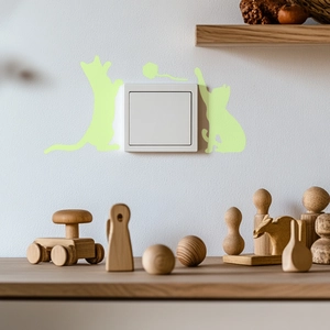 Luminous cartoon cat wall stickers for light switch decoration with glowing cat silhouettes